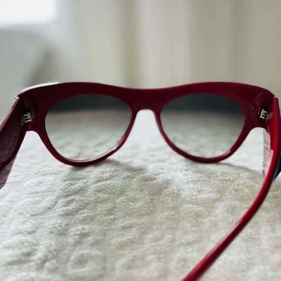 New authentic Prada sunglasses in red with blue stones. main image 7